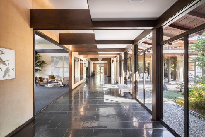 Long modern indoor corridor with glass walls and modern Japanese-style design